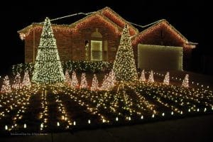 House Decked Out In White Christmas Lights