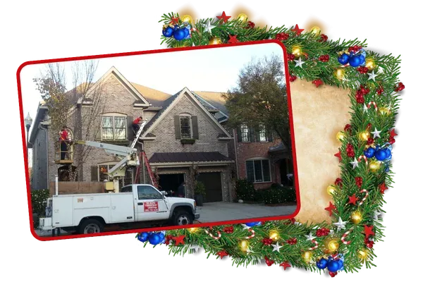 Professional holiday decorators work truck and lift at a home